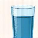 Glass of water with condensation, representing hydration challenge.