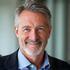Portrait of Mike Harrison, a confident man in his early 50s